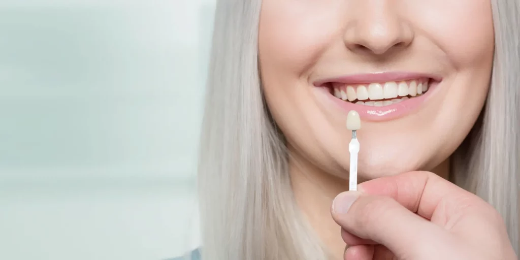 Woman picking traditional porcelain veneers at Kraja and Sidhu Dental office in Silver Spring