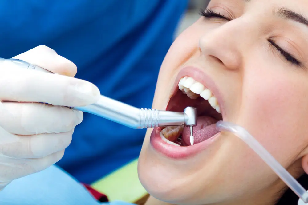 Woman receiving a professional dental hygiene treatment from Dr. Sidhu in Silver Spring