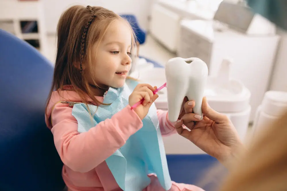 a young patient building a trust with a pediatric dentist in Silver Spring, MD during her first appointment.
