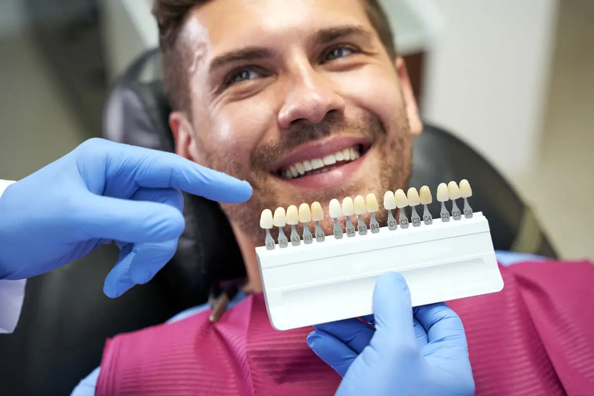A man selecting porcelain venners at our Silver Spring Dental center.